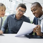 insurance agent reviewing a policy with a couple