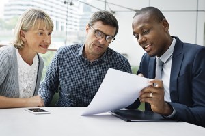 insurance agent reviewing a policy with a couple