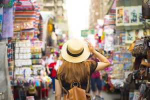 best asian countries to visit - woman walking through a busy market