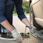 car care - mechanic putting the car on a lift