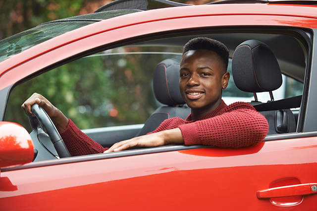 car insurance for teens - young teenager in the driver seat