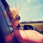 woman looking out the passenger side window