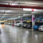 various cars in packed in a parking lot