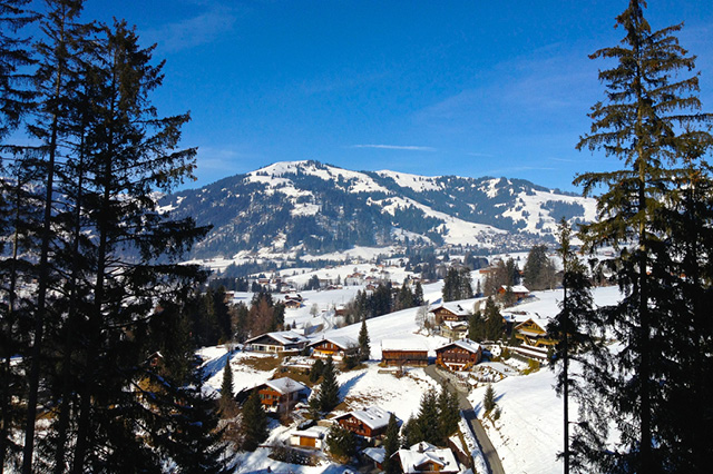 Chalets in a snowy valley in Gstaad, Switzerland