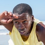 A man who appears to be exercising at the beach.