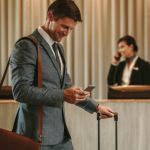 hotel tech - guest using his smartphone