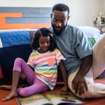 father and daughter reading