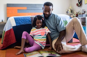 father and daughter reading