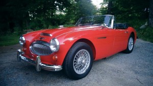 Red sports car in driveway