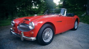 Red sports car in driveway