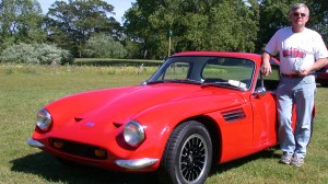 Man with red sports car