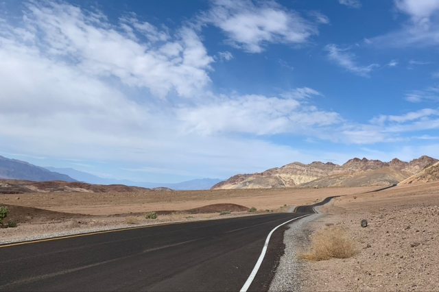 paved windy road through hills