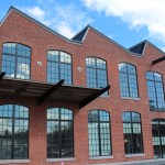 Red brick building with jagged roof