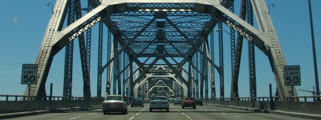 car superstitions cars driving over bridge