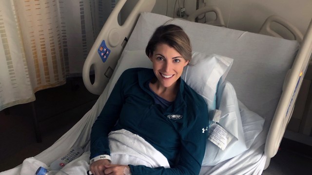 Young woman in hospital bed.