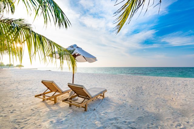 chairs on beach. sustainable beach vacation.