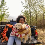 woman hugging dog