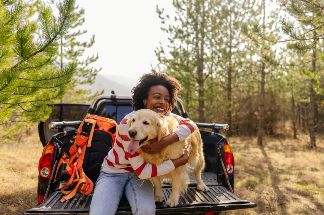 woman hugging dog