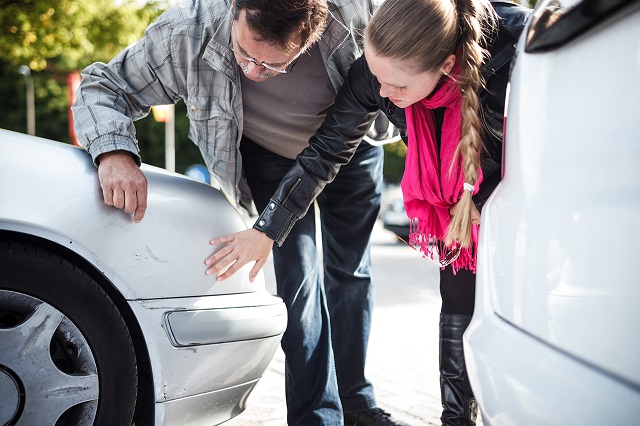 people examining car