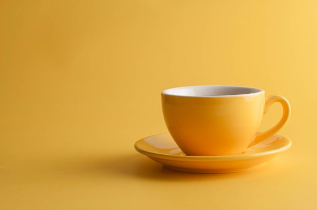 yellow cup on yellow background