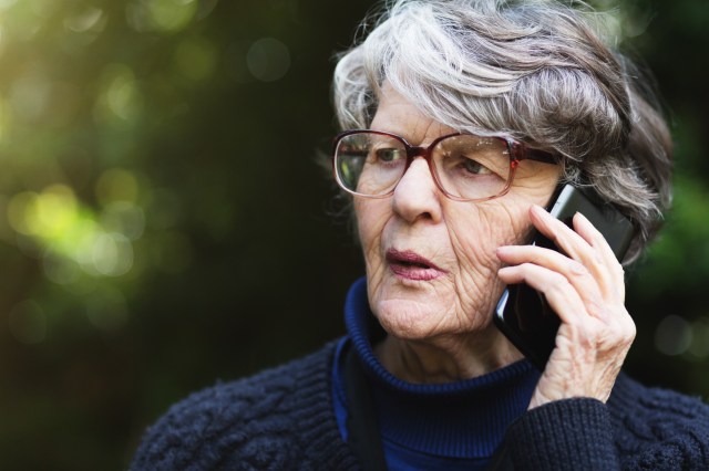 life insurance scams - senior woman on phone