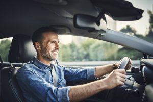 man driving a car