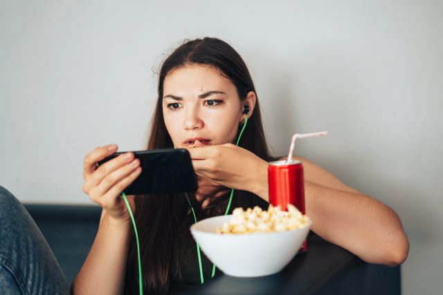 Girl in green headphones