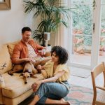 how to save on life insurance - couple on couch with dog