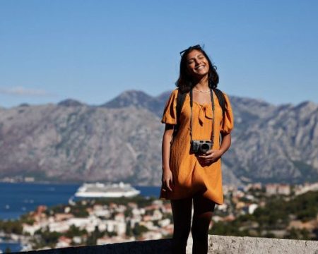 sustainable travel - girl with camera