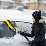cleaning snow off car