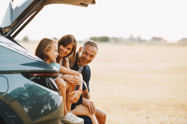family in car